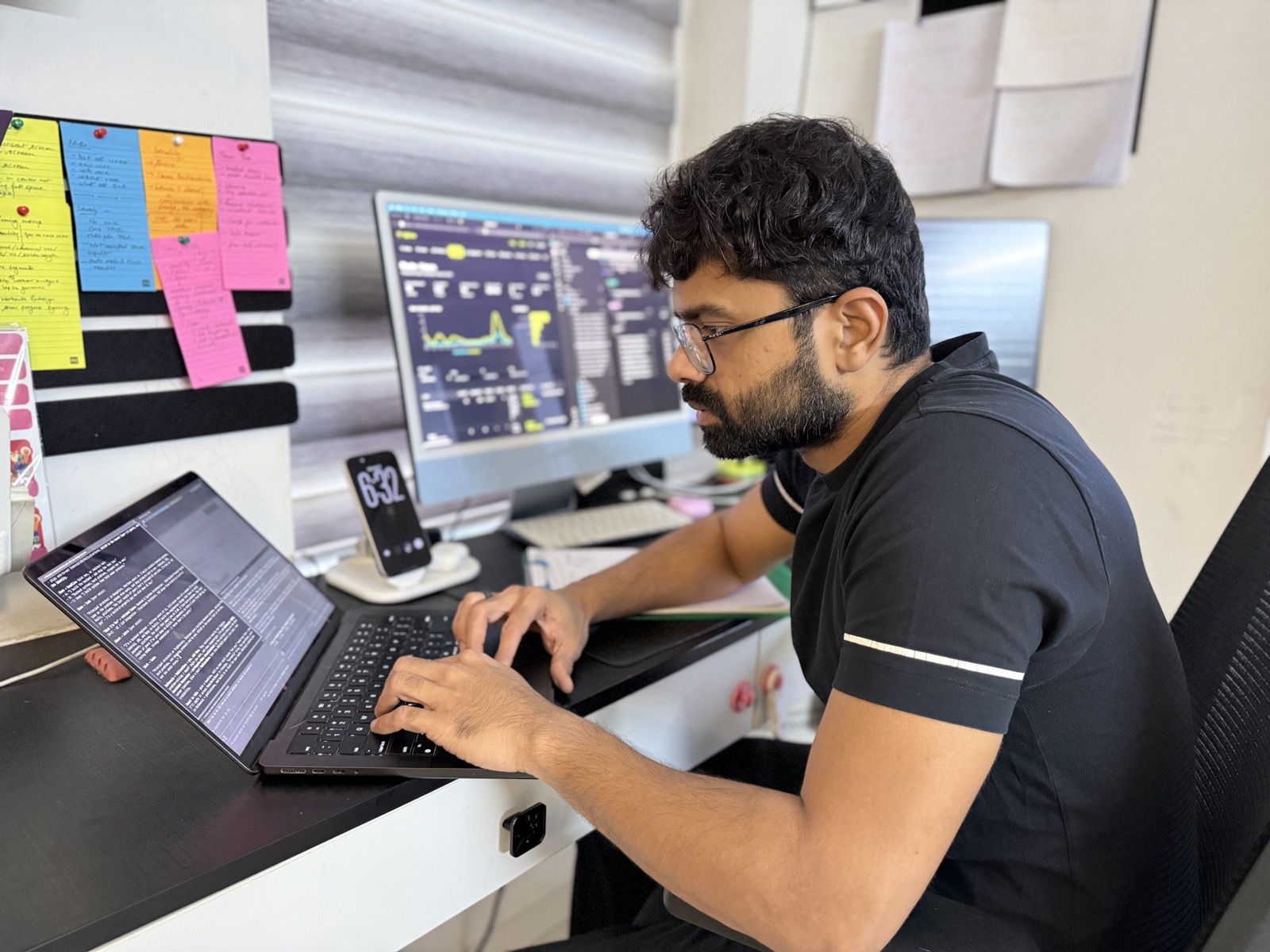 Naman at his desk, building